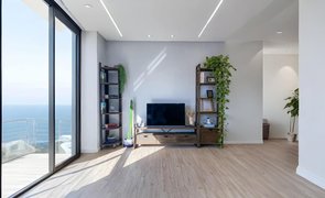 sala de casa com vista para o mar